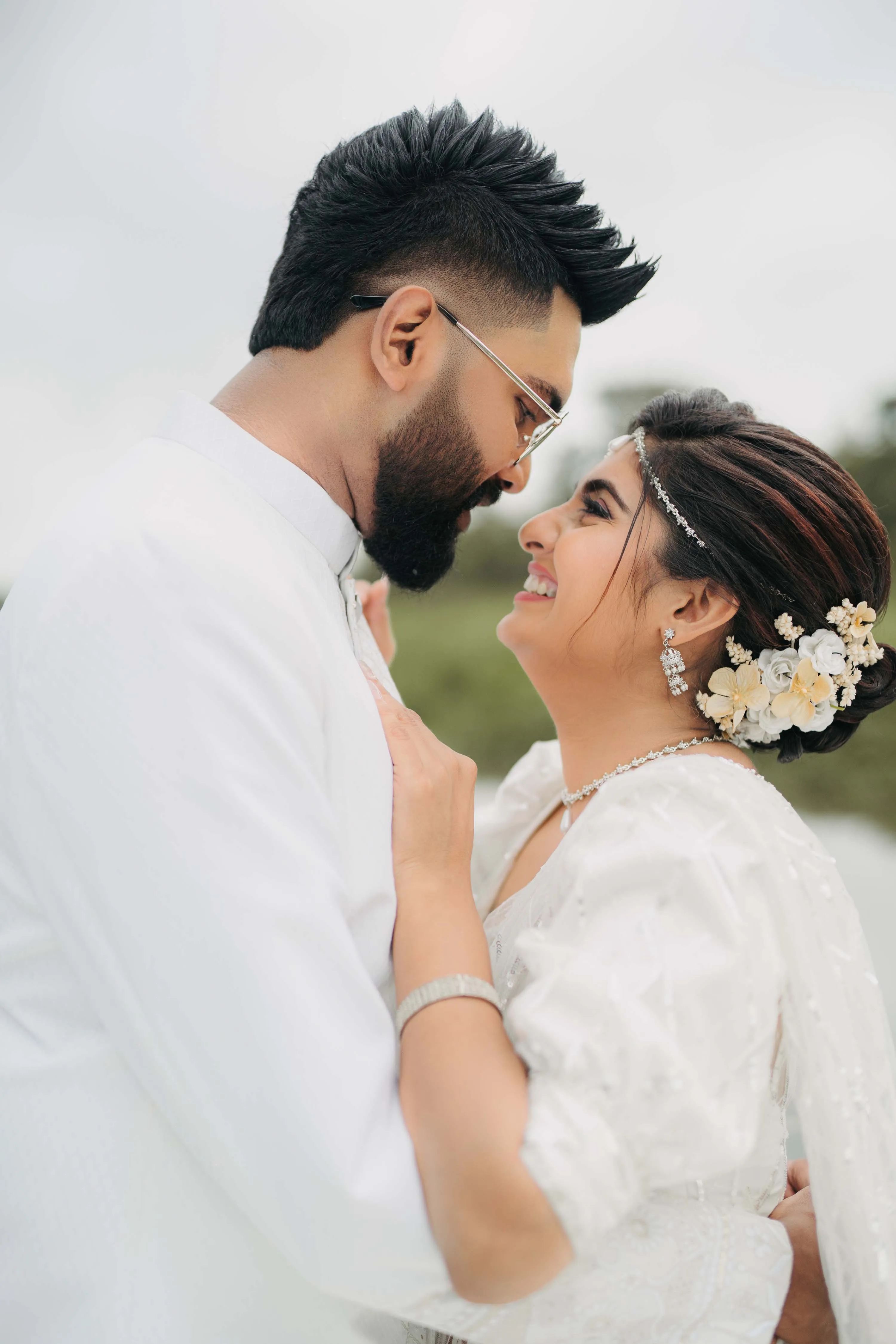 Intimate romantic moment of couple in white